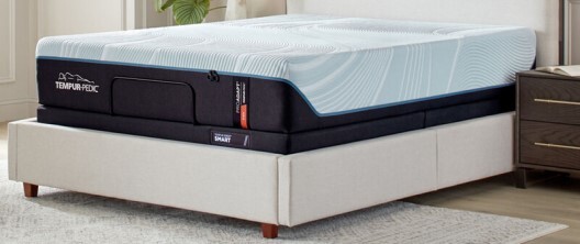 A bare memory foam mattress on a flat foundation