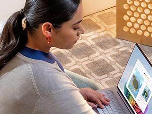 Woman looking at laptop computer