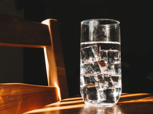 A glass of water with standard-issue ice cubes