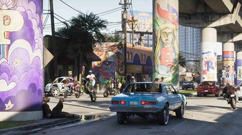 A screenshot from the game GTA 6 which depicts cars and motorcycles driving in a neighborhood.