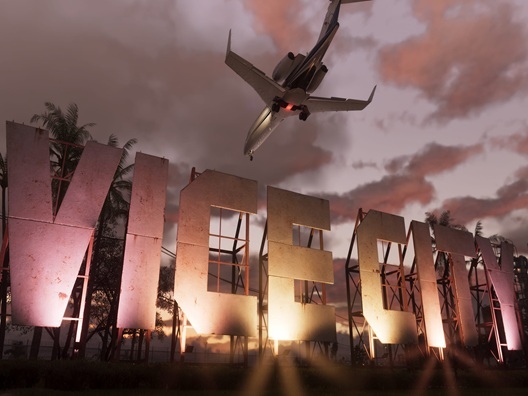 A screenshot from the game GTA 6 which depicts a plane flying over a Vice City sign.