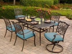 Seven-piece patio dining set with blue cushions