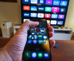 A smartphone and a TV packed with streaming app options
