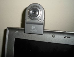 A 2000s-era webcam clipped to a laptop screen