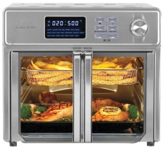 Stainless steel Kalorik toaster oven with fries cooked on the top rack and fish cooked on the bottom rack